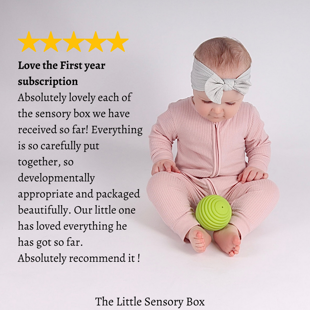 A review of the Baby's First Year Subscription Box and a baby playing with a green textured sensory ball.