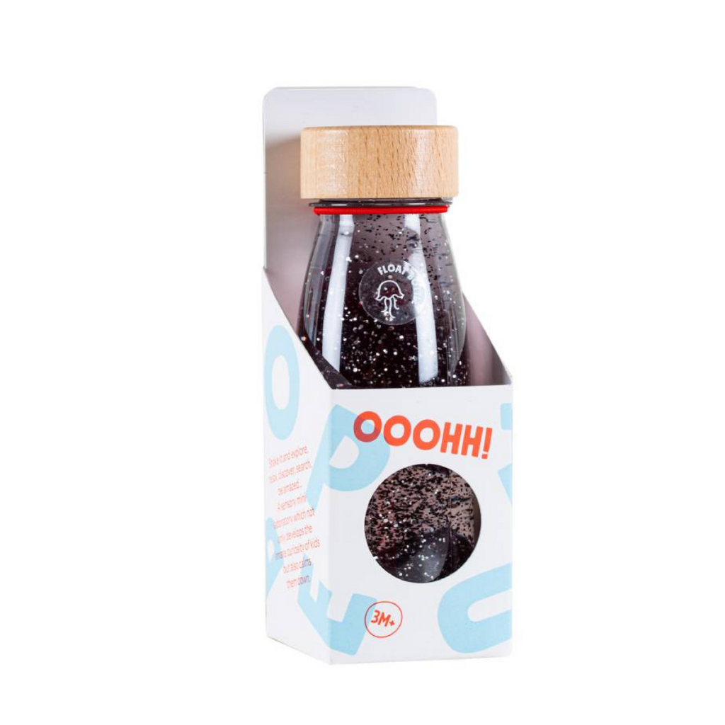 Petit Boum black sensory float bottle in it's packaging box.